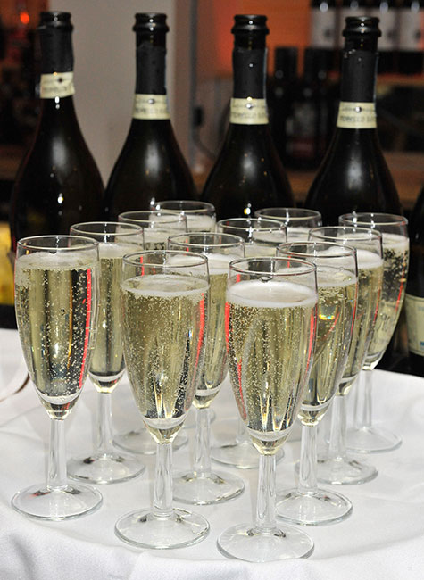 Champagne bubbling in glasses on a table at a party in Swindon